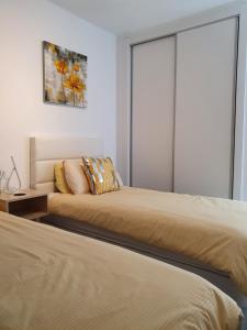 Postel nebo postele na pokoji v ubytování Cuatro Vientos