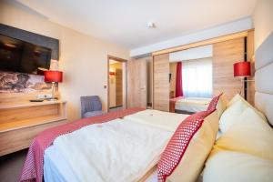 Postel nebo postele na pokoji v ubytování Centralhotel Binz