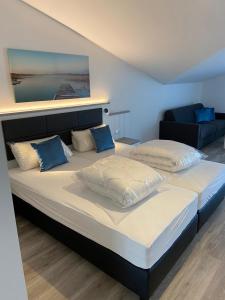 Ένα ή περισσότερα κρεβάτια σε δωμάτιο στο Meerblickvilla Großenbrode