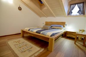 En eller flere senge i et værelse på APPARTAMENTO GIRASOLE