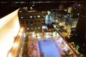 an overhead view of a building with a swimming pool at Windsor Guanabara Hotel in Rio de Janeiro