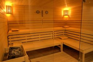 a sauna with two benches and two lights in it at Moselromantik Hotel Am Panoramabogen in Cochem