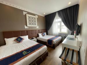 Postel nebo postele na pokoji v ubytování Pinus Hotel