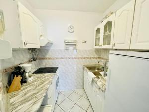Kuchyňa alebo kuchynka v ubytovaní Neptun by Baltic Home
