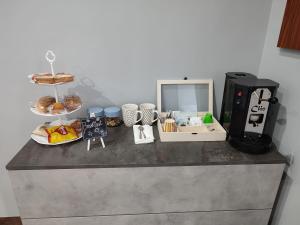 a counter top with a bunch of food on it at Diora Suite in Pompei