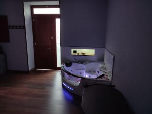 a bathroom with a bath tub in a room at Diora Suite in Pompei