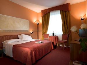 Postel nebo postele na pokoji v ubytování Hotel Bifi