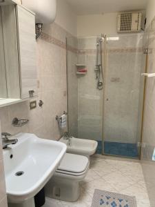 a bathroom with a toilet and a sink and a shower at DONNA CONCETTA HOUSE in Ravello