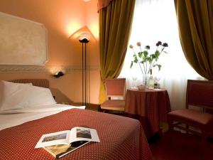 Postel nebo postele na pokoji v ubytování Hotel Bifi