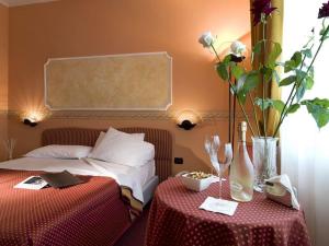 Postel nebo postele na pokoji v ubytování Hotel Bifi