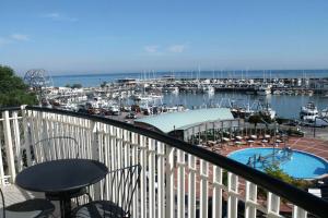 a balcony with a view of a marina with boats at Residence Fiorella in Cattolica