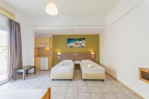 En eller flere senger på et rom på Simple Hotel Hersonissos Sun