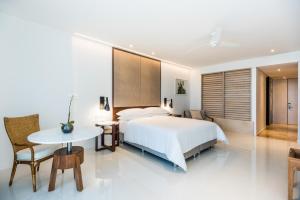 Cama o camas de una habitación en Dreams Karibana Cartagena Golf & Spa Resort