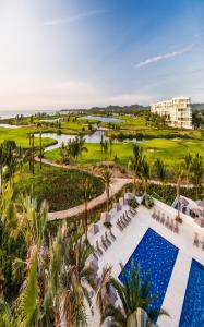 an aerial view of the resort with a pool and golf course at Dreams Karibana Cartagena Golf & Spa Resort in Cartagena de Indias