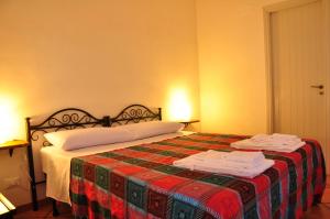 Postel nebo postele na pokoji v ubytování B&B Tre Giummare + 31 fotografií