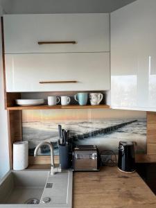 A cozinha ou cozinha compacta de Sea View Apartament 5 min od morza