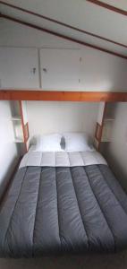 Postel nebo postele na pokoji v ubytování Chalet mobil-home