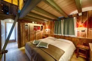 Postel nebo postele na pokoji v ubytování Les Plaisirs d'Antan