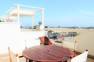a table and chairs on a balcony with a view of the ocean at Residence Fiorella in Cattolica