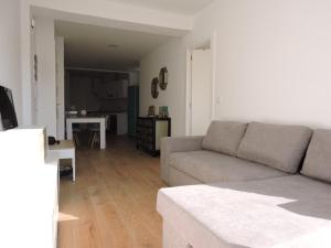 a living room with a couch and a table at Apartamento Garcar in Murcia