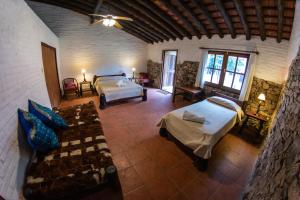 Ένα ή περισσότερα κρεβάτια σε δωμάτιο στο Pinos de la Quebrada