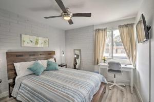 a bedroom with a bed and a ceiling fan at Chic Scottsdale Home with Balcony, Walk to Old Town! in Scottsdale +24 photos