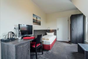TV a/nebo společenská místnost v ubytování Hotel Bloemfontein