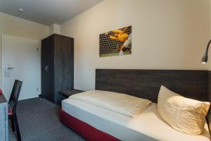 Postel nebo postele na pokoji v ubytování Hotel Bloemfontein