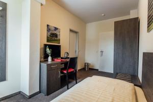 Postel nebo postele na pokoji v ubytování Hotel Bloemfontein