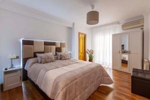 Posteľ alebo postele v izbe v ubytovaní Apartamento Mariana Pineda Centro