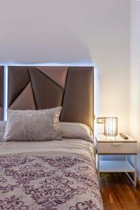 Posteľ alebo postele v izbe v ubytovaní Apartamento Mariana Pineda Centro