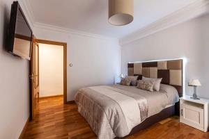 Posteľ alebo postele v izbe v ubytovaní Apartamento Mariana Pineda Centro
