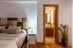 Posteľ alebo postele v izbe v ubytovaní Apartamento Mariana Pineda Centro