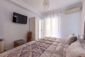 Posteľ alebo postele v izbe v ubytovaní Apartamento Mariana Pineda Centro