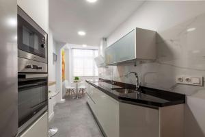Kuchyňa alebo kuchynka v ubytovaní Apartamento Mariana Pineda Centro