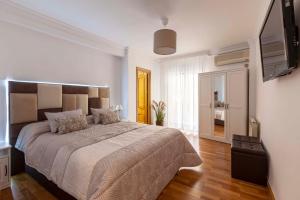 Posteľ alebo postele v izbe v ubytovaní Apartamento Mariana Pineda Centro