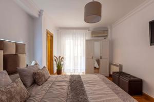 Posteľ alebo postele v izbe v ubytovaní Apartamento Mariana Pineda Centro