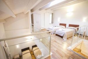 Postel nebo postele na pokoji v ubytování Hotel Arezzo ASC