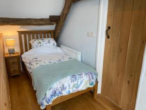 Voodi või voodid majutusasutuse Pant Llwyd Farm toas
