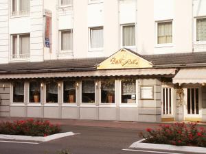 a building with a sign on the front of it at Hotel Niederée in Bad Breisig