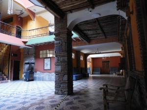 a room with a stone pillar in a building at ISKAY BOUTIQUE HOSTEL in La Paz