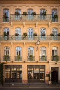 a building with lots of windows and plants at Hotel Albert 1er in Toulouse