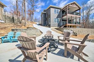 a group of chairs and a table in front of a house at Lakefront Rocky Mount Home with Dock and Fire Pit in Rocky Mount
