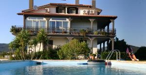 a house with a swimming pool in front of a house at La Mia Casa per Tutti in Cerveteri