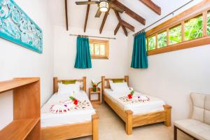 Katil atau katil-katil dalam bilik di Hotel Casa Merlin
