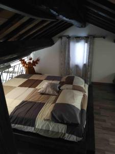 a bedroom with a large bed with a canopy at CasaLina in Comacchio