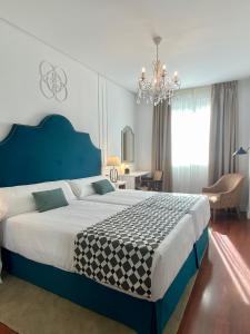 Cama o camas de una habitación en Hotel Derby Sevilla