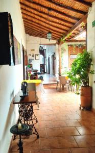 a patio with tables and chairs in a room at Giron Chill Out Hotel Boutique in Girón