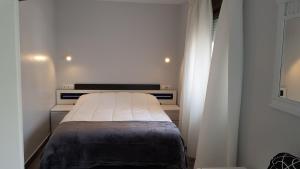 Posteľ alebo postele v izbe v ubytovaní Nuevo Hotel Sydney