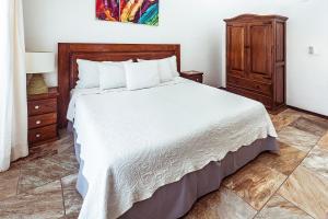 Postel nebo postele na pokoji v ubytování Fabiola Condo Hotel